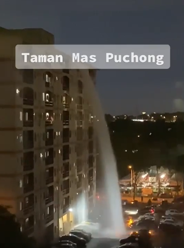 The water tank of a Sepang apartment ruptured, causing a massive waterfall. Image credit: ameiraaaa