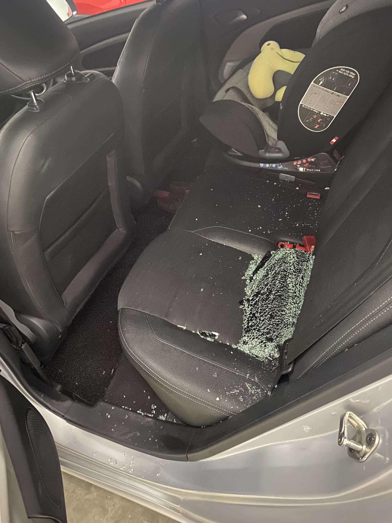 The backseat of his car was showered in glass shards. Image credit: @irfannhaziq_