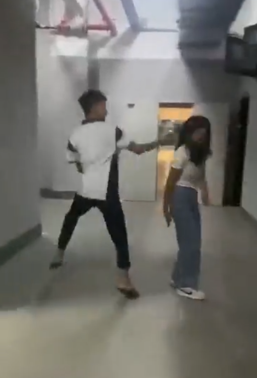 A teenaged boy was seen beating up a defenseless girl in a now viral video clip. Image credit: @neelofa