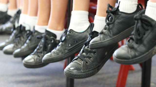 A Form 1 student claims she was told to kneel in-front of her school assembly for not wearing the right shoes. Image for illustration only. Image credit: iStock
