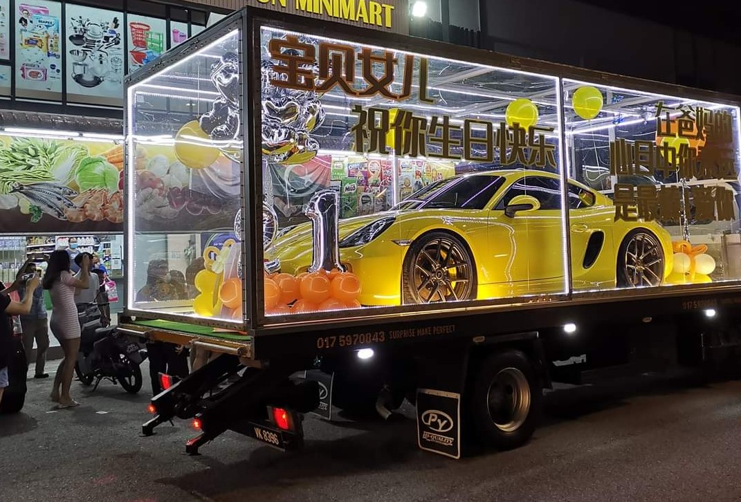 A couple from Batu Pahat surprised their daaughter with a brand-new Porsche for her birthday. Image credit: Sin Chew Daily