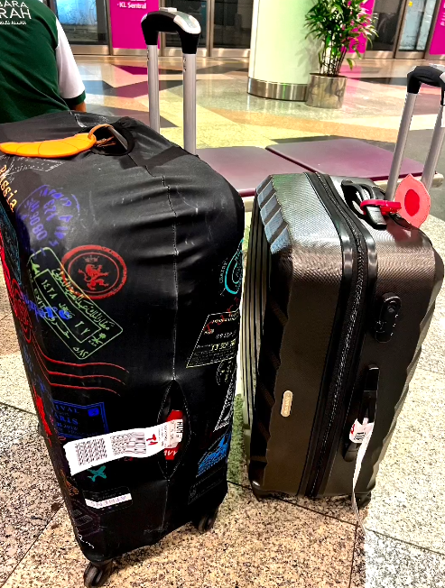 One of their luggage protector sleeves had also been peeled off from their bags. Image credit: premosupremo